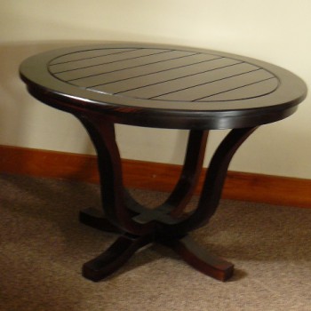 Slat detailed round side table with dark stain