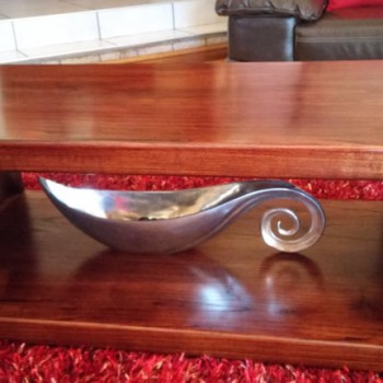 Modern simplistic curbed coffee table in Syringa berry