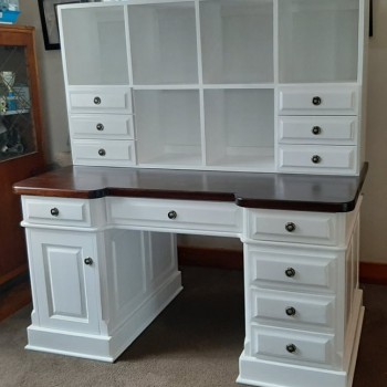 Craft room desk and storage solution. Cubbyholes and many drawers in solid wood painted white and saligna top