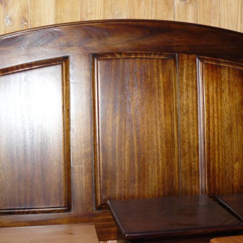 Panelled headboard with a curved top in solid wood