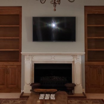 Full built-in custom bookcase and storage in solid oak