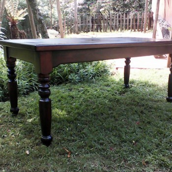 Solid wood dark stained dining table with turned legs